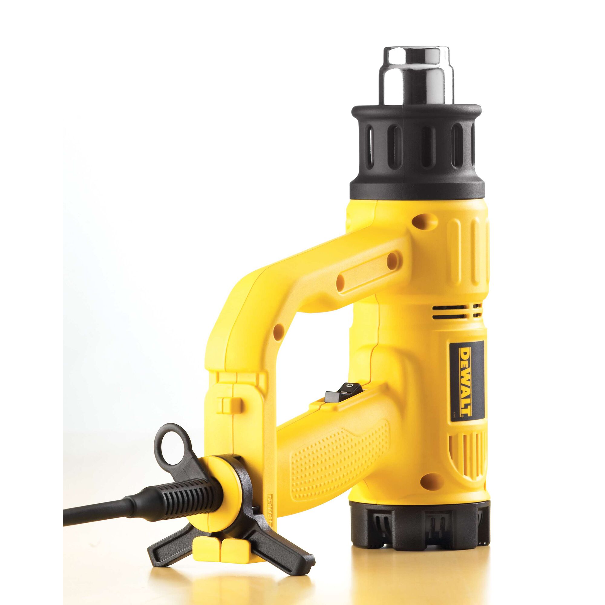 A yellow DEWALT heat gun with a black and silver nozzle, ergonomic handle, and power cord. The tool is designed for professional and DIY use.