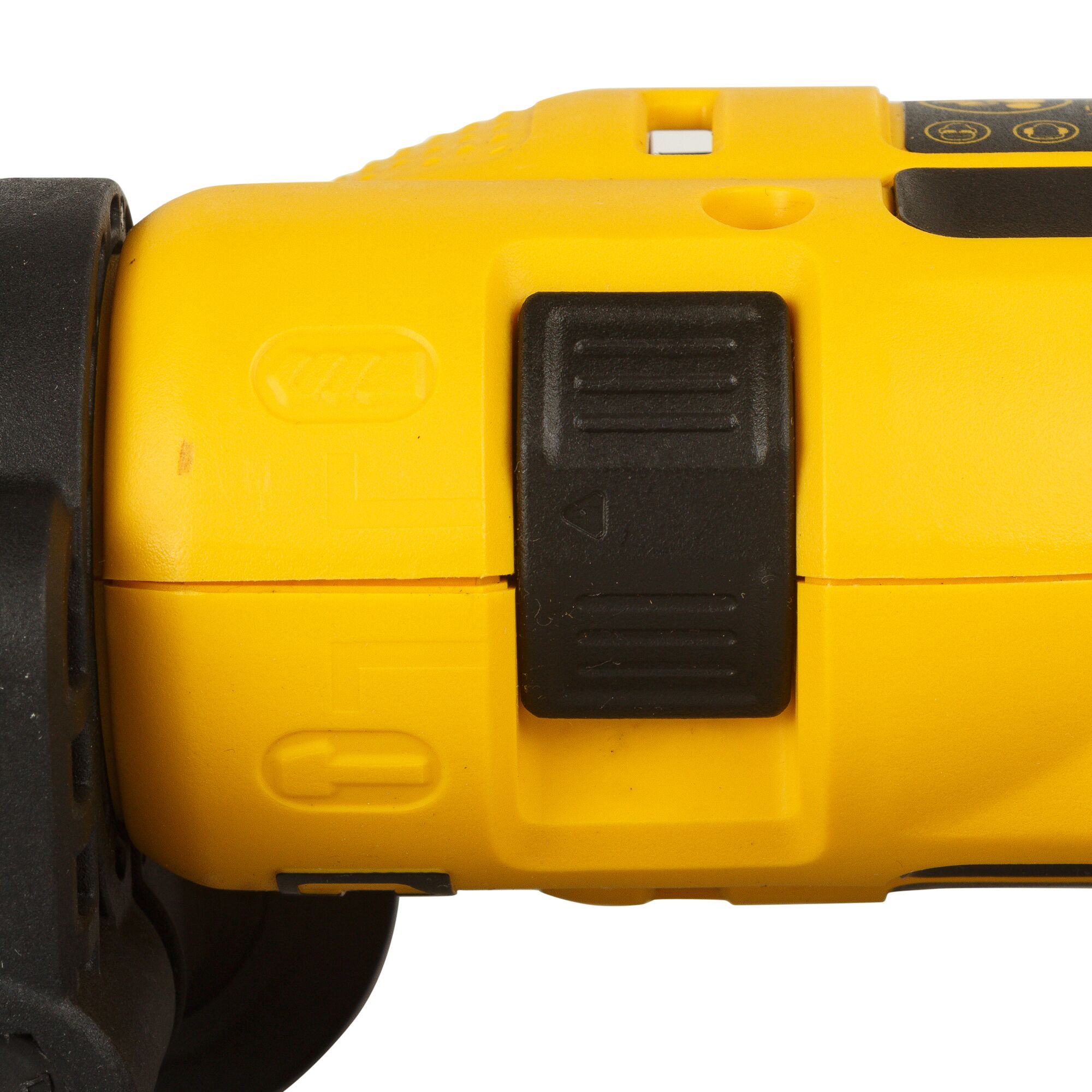 Close-up view of a yellow DEWALT power tool, showing a black mode selector switch on its side.