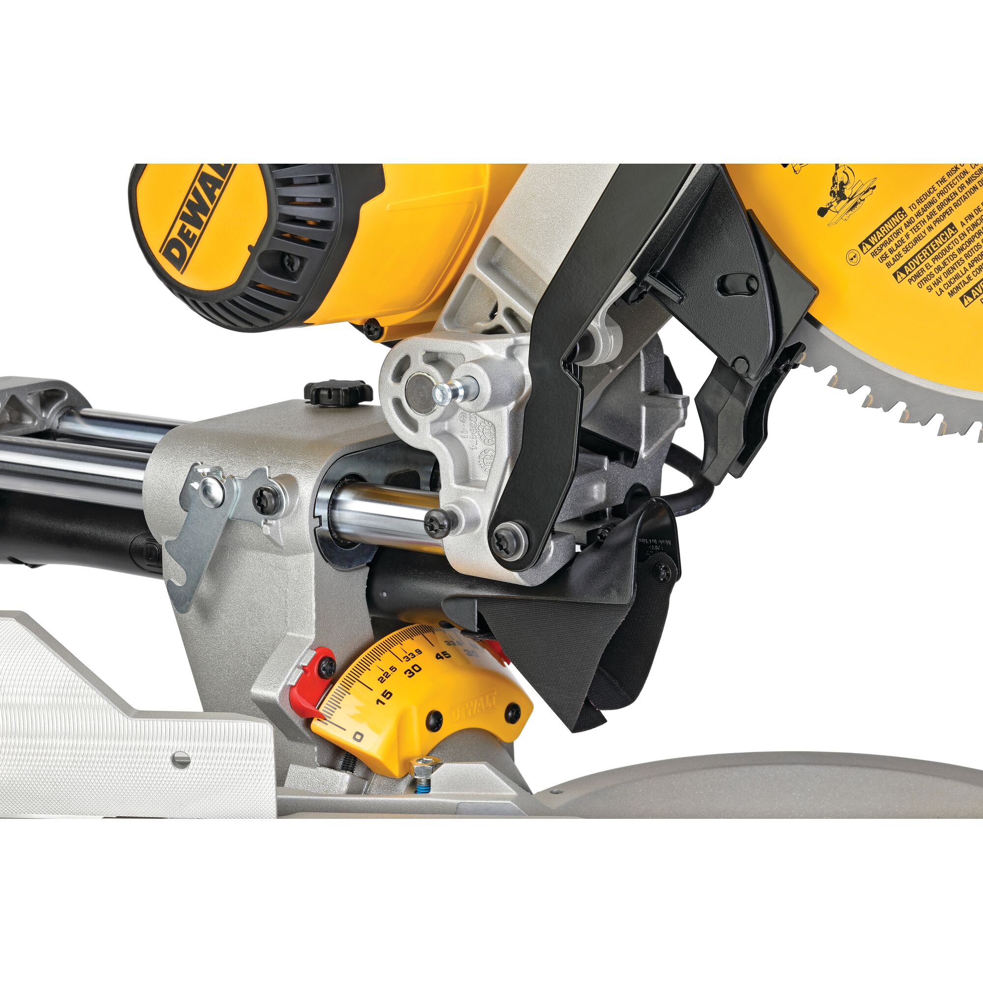 Close-up view of a DEWALT sliding compound miter saw, showing its mechanism, saw blade, angle adjustment scale, and safety guard.