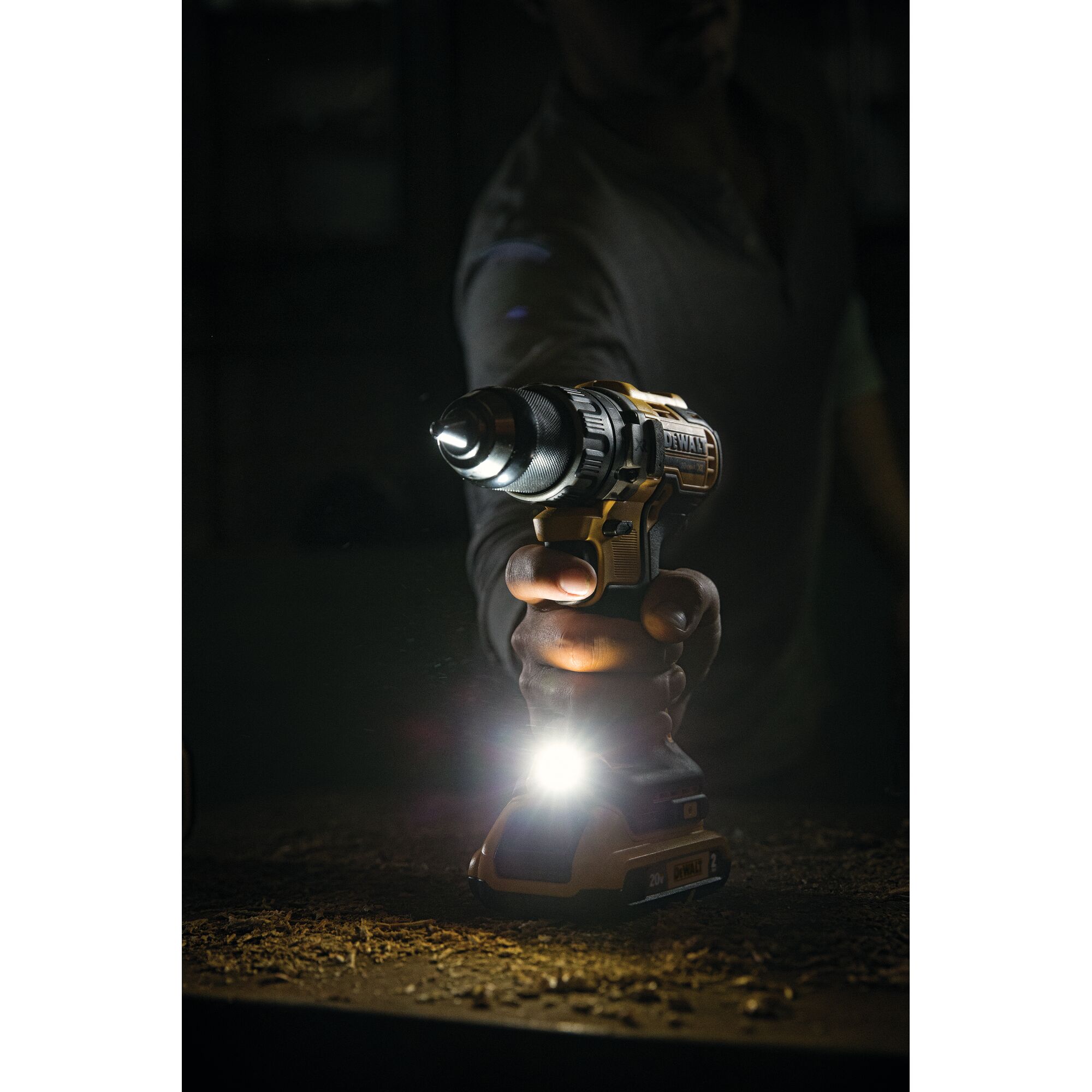 Lithium Ion XR Brushless Compact Hammer drill illuminating light in  workspace.